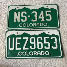2 VINTAGE COLORADO LICENSE PLATE ROCKY MOUNTAINS. Man cave. Bar.garage expired. picture