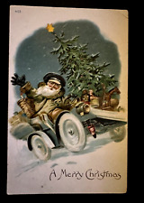 Unusual~Brown Robe Santa Claus in Car with Tree~Toys~Antique~Xmas~Postcard~k454 picture