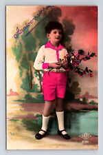 c1933 RPPC Young French Boy With Flowers Pink Shorts Postcard picture