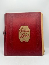 Vintage red scrap book filled with cut out clippings from 50's 60's picture