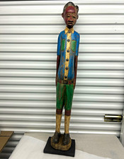 African Wooden Colon Figure Standing Male Sculpture in Blue Shirt & Green Shorts picture