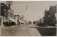 Weyauwega Wisconsin WI Postcard RPPC Main Street Dirt Road Horse Carriage picture