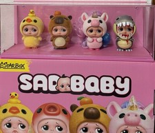 New Zuru StarBox SadBaby Figure Set of 4 w/ Display Case. picture