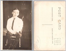 RPPC Seated Boy Studio Portrait Photo Postcard picture