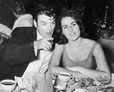 William Campbell sits wife Judith Exner Campbell at a table pointi- Old Photo picture