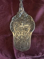 Antique German silver serving utensil with ornate design picture