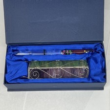 vintage stained glass kaleidoscope with a prismatic oil/glitter wand picture
