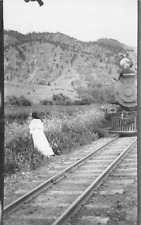RPPC Women in White Standing Besides Train Tracks As Locomotive Approaches c1910 picture