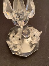 Glass Baron Mother bird feeding babies picture