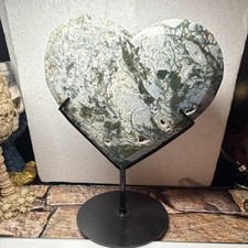 Green/White Heart-Shaped Polished Stone Slice on Black Metal Stand picture