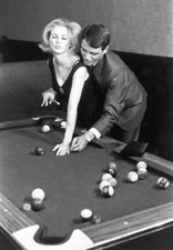 Man shows a woman how to hold a pool cue 1960s Historic 1960s Old Photo picture