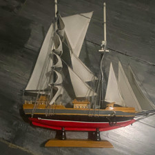Wooden Sailboat Model Sailing Ship with White Sails on Display Stand picture