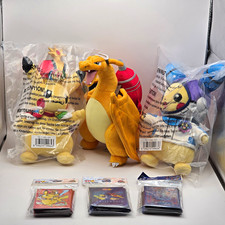 Pokémon Worlds Exclusive Plushies And Card Sleeves picture