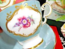 Susie Cooper tea cup and saucer baby blue floral pink rose and gold cameo teacup picture