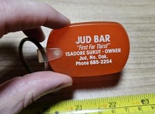Vintage Jud Bar Isadore Sukut North Dakota Advertising Keychain picture