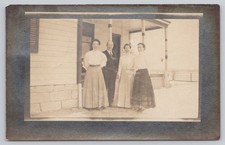 1910 Spencer Nebraska RPPC Postcard - Family on Porch, Greenfield PO Message picture