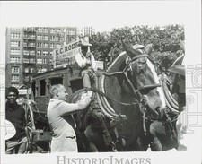 1973 Press Photo Mayor Charles B. Wheeler admiring a horse drawn carriage picture