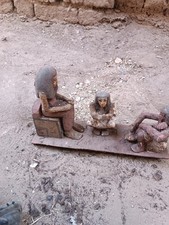 Ancient egyptian antique wooden figurine group depicting daily life social scene picture