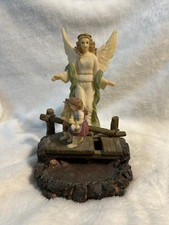 An Angel Watching Two Children Cross A Bridge. She Is Their Guardian Angel. picture