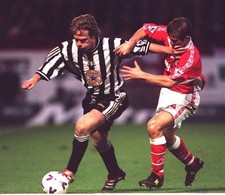 Newcastle United's Warren Barton fights off a challenge from Charl- Old Photo picture