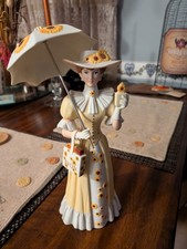 Avon President's Club 2012 Mrs. Albee Award Porcelain FigurineSunflower Umbrella picture