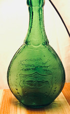 Vintage Green Glass Decanter Bottle, Flask-Style, Embossed Shield Design. picture