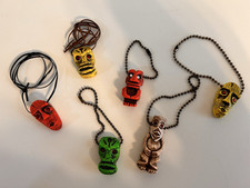 6 DIFFERENT TIKI'S 3 WITH KEY CHAINS  3 HAVE CORDS 5PCS. GLOW W/ BLACK LIGHT picture