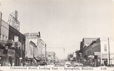 Commercial Street Springfield Missouri Looking East Cars Storefronts Postcard picture