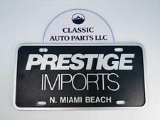 Prestige Imports N Miami Beach Vintage Dealer License Plate Tag Black White picture