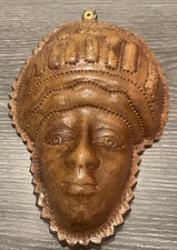 leather wall hanging depicting an African face picture