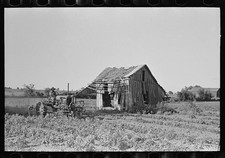 Photo:Wagoner County Oklahoma 1939 Tractor Plowing Abandoned Tenant House picture