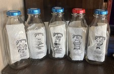 Broguiere’s Glass Milk Bottles Four Different Logos 5 Bottles picture