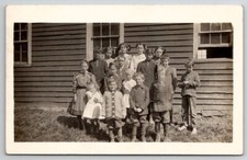 RPPC Rural Schoolhouse Children Class Photo Poor Sad Child No Shoes Postcard U29 picture