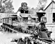 WALT DISNEY WORKING ON HIS MODEL RAILROAD TRAIN - 8X10 PHOTO (BB-634) picture
