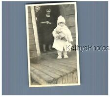 FOUND B&W PHOTO H_5180 CUTE BABY HOLDING KEWPIE DOLL, TWO WOMEN IN BACK picture