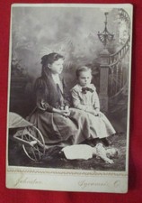 Cabinet Card Photo, Boy and Girl Seated on Cart, Doll on Floor picture