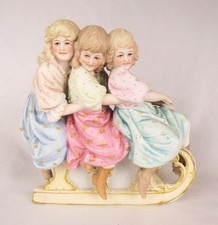Antique Painted Bisque Three Young Girls Riding on Sled Figurine - Fabulous picture