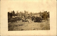 WWI era RPPC ~ American? Soldiers with rifles along with civilians in suits picture
