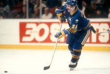 Gilbert Perreault Buffalo Sabres passes the puck at an NHL game v - Old Photo picture