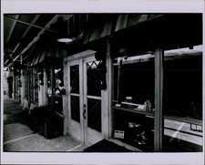 LG862 Original Tom Mosier Photo BUSINESS ENTRANCE Dark Favcade Bars Doors View picture