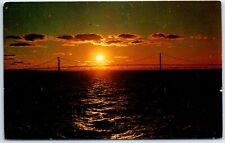 Mackinac Straits Bridge is silhouetted against the setting Sun - Michigan picture
