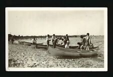 Winnipeg Beach Manitoba - People behind canoes pulled up on shore Old Photo picture