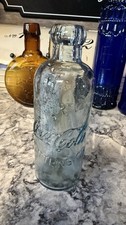 Vintage 1997 Coca-Cola Embossed Aqua Glass Soda Bottle 6 3/4” Reproduction picture