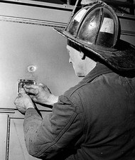 Fireman Edward Upton driver Engine 14 examines sniper bullet - Boston Old Photo picture
