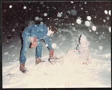 Vintage Photograph Man Pulling Sled in Snow Storm picture