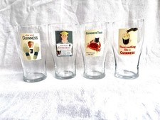 Guinness Vintage Tulip Shaped Pint Glasses with Classic Advertising Artwork picture