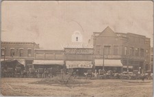 Store Fronts Erie PA Groceries Dry Goods Shoe Sale to FL RPPC 1900s Postcard picture