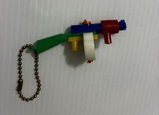 Vintage 1950’s Thompson Machine Fun/Tommy Gun Puzzle Keychain picture