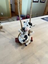 Vintage Black And White Cow On A Rope Swing picture