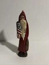 hand-carved and hand-painted wooden folk art Santa Claus figurine picture